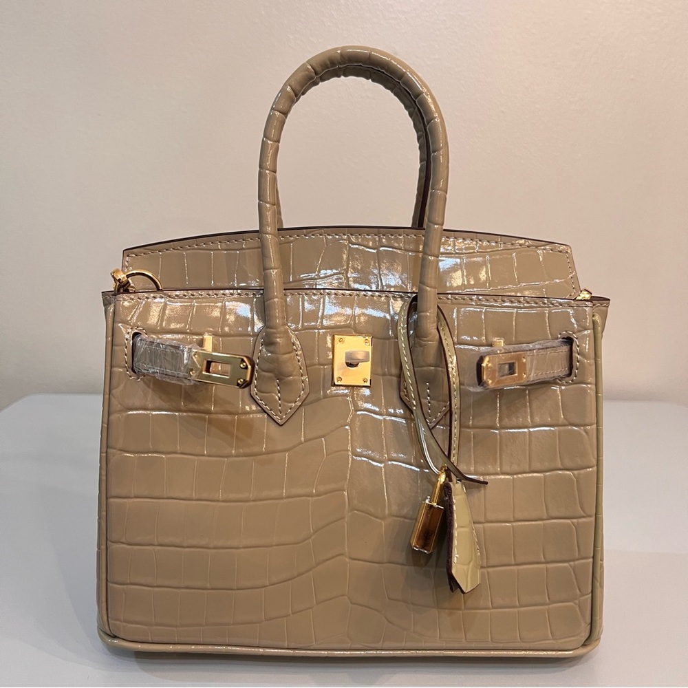 Leather embossed in crocodile print, 25cm, with gold hardware.